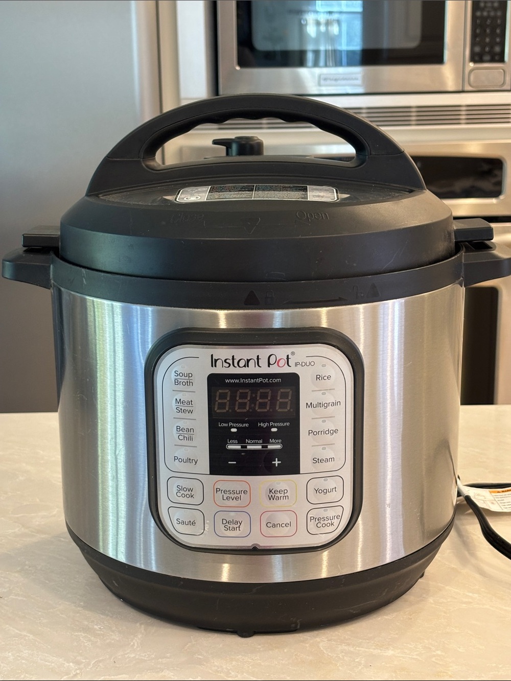 6-Qt Electric Pressure Cooker in Stainless Steel and Black